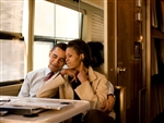 This print is a photograph of Barack and Michelle Obama sharing a quiet moment together in a diner.